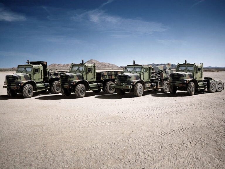 Oshkosh Defense MTVR family of vehicles parked in a row.