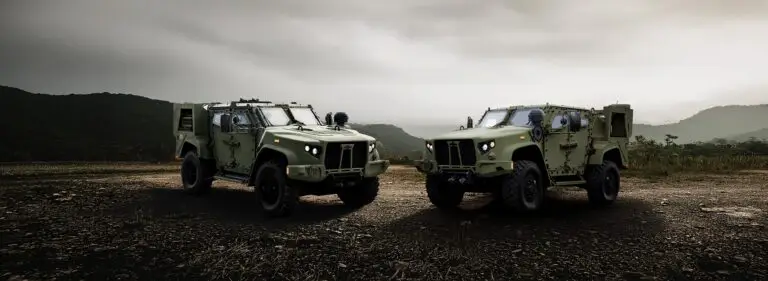 Oshkosh Defense JLTV and eJLTV parked side by side.